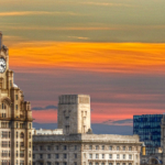 A view of Liverpool Waterfront taken at sunset, showing the Liver Building,, the Cunard Building and the Port of Liverpool Building. The Anglican Cathedral can be see in the background. The CRA Awards 2023 will be held in Liverpool.
