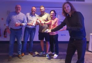 The winning golf team at the CRA Summer Social 2023 receiving their award from Sean Percival